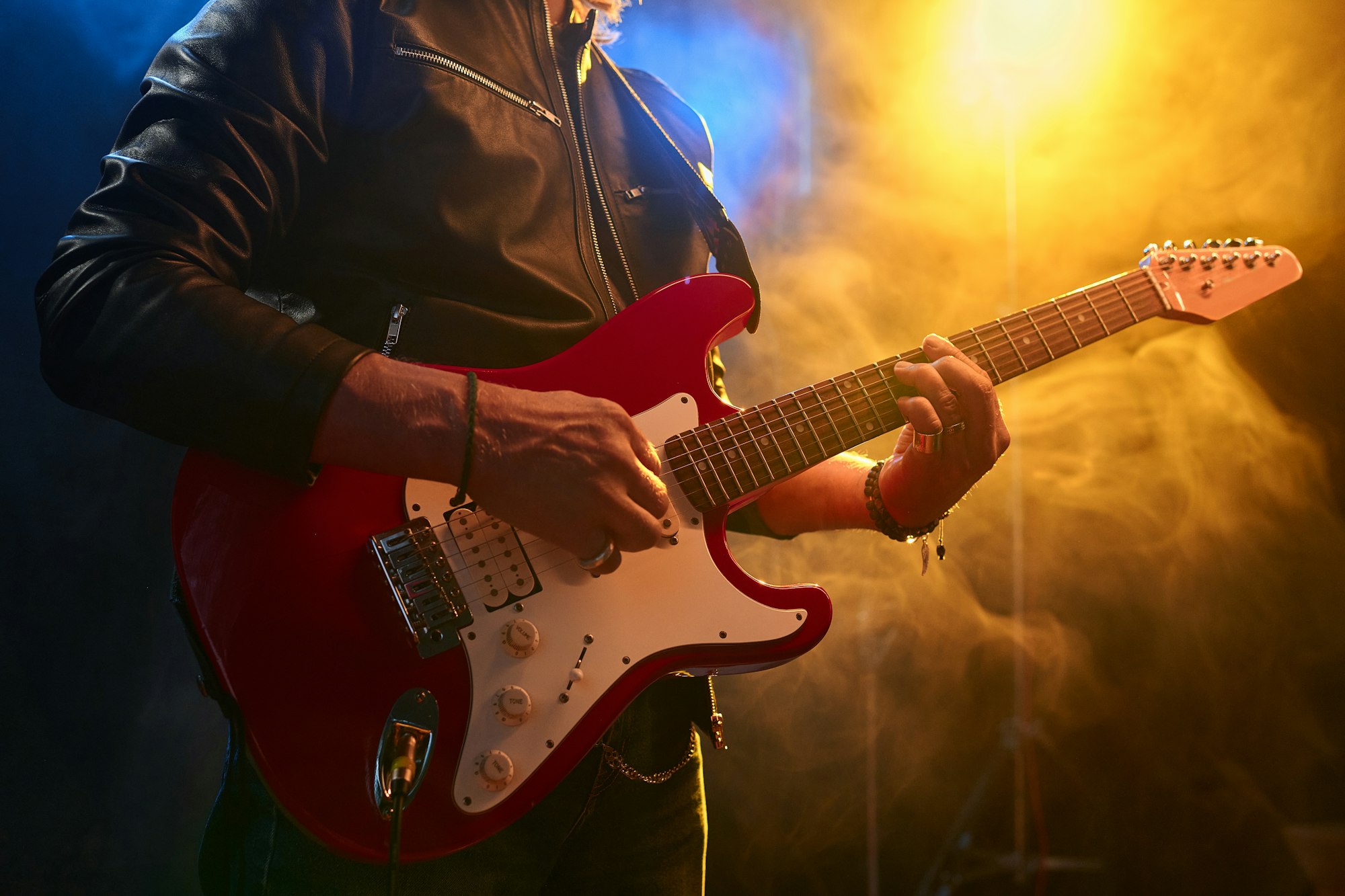 Rock Musician Playing Electric Guitar on Stage